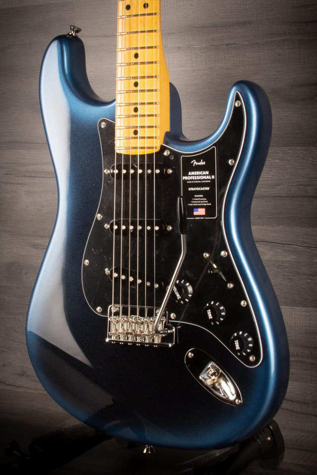 The Fender American Professional II Stratocaster Dark Night depicted on the background of a brown wall