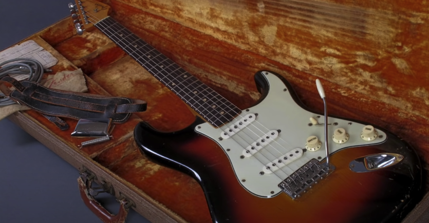 Photo of a Fender Stratocaster electric guitar inside a wooden case