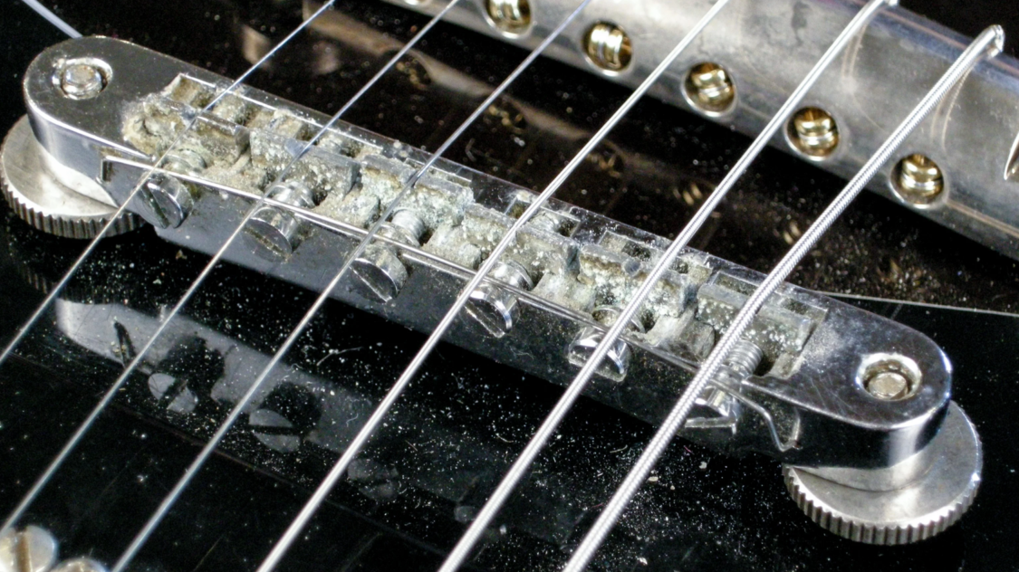a closeup view on Fender guitar, strings